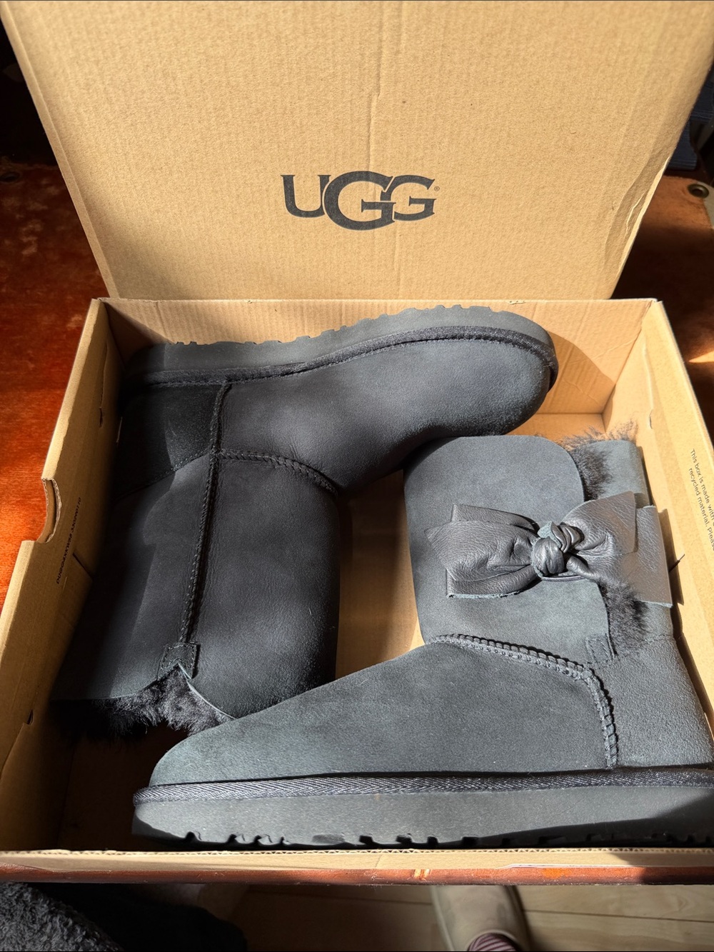 UGG Daelynn Black Bow-Accent Shearling Short Boots - Picture 14 of 17
